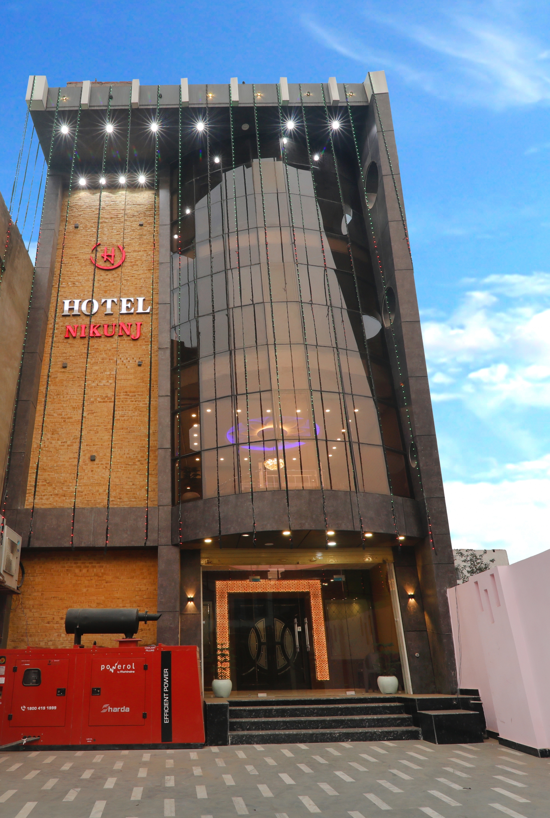 Hotel Nikunj facade at night